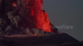 Extraordinary moment Russian volcano erupts as lightning strikes it