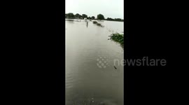 Brave boy guides ambulance by running though flood waters