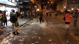Man putting off tear gas canister with food dishes
