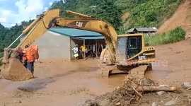 Excavator used to transport people trapped by flooding in Vietnam
