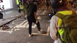 Hong Kong protester uses steel bowl to neutralise tear gas canister