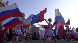 Dance with Russian flags at World circle dance on Palace square, St. Petersburg, Russia