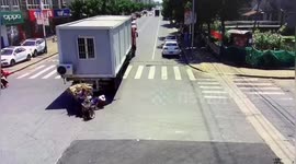 Woman run over by truck after falling out of a three-wheeler in eastern China