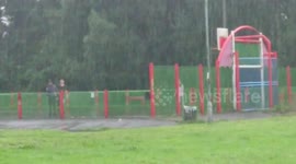 Kids Play Football In Heavy Rain (Thunderstorm)