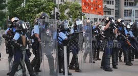 Tear gas fired by Hong Kong police met with defiance from protesters