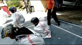 Sack race and wearing a helmet