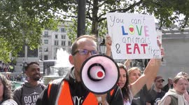 Vegan activists of Animal Rebellion sitin and blockade Charing Cross, London, UK