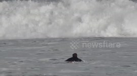 Big waves working surfers in Galizia