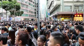 Protesters walking through very crowded streets to join a pro democracy rally in Hong Kong
