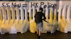Hong Kong activists spray