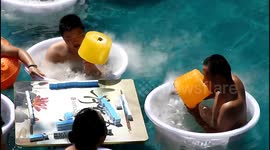 Chongqing residents enjoy giant 5 kg ice lollies to stay cool during heatwave