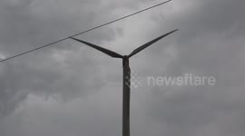 Loud noisy green energy producing wind turbine.
