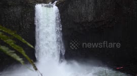 kayaker descends monster waterfall slowmo