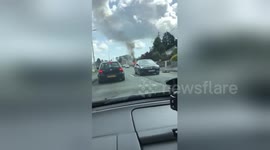 Red flames rise from van abandoned on Wales road