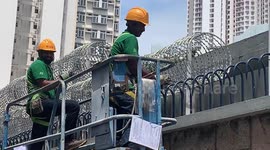 Razor wire installed at Hong Kong police station