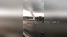 Terrifying moment tornado appears out of nowhere, sweeping through Amsterdam