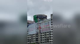 Demolition worker spotted swinging sledgehammer at 12-storey apartment block in Thailand
