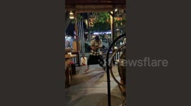 Indonesian waiter entertains guests with dance moves