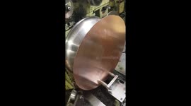 Metal spinning machine satisfyingly creates cylinder top from copper disc