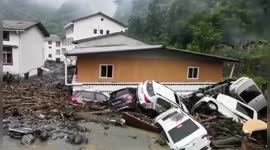 Strong rainstorm sees floods and mudslides wreck Chinese city, killing eight people