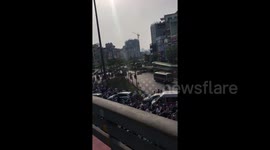 Thousands of cars and motorcycles queue in rush hour traffic in Vietnam