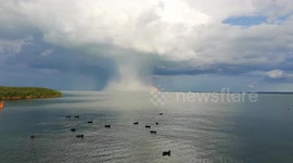 Huge mushroom shaped cloud forms over a lake in Hungary