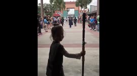 Four-year-old girl dressed as Rey meets Star Wars characters at Disney World in Florida