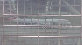 British Airways plane reflects in Heathrow Airport (Terminal 5)