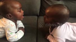Adorable babies discover they are identical twins