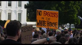 Protesters Outside The White House Hold Signs