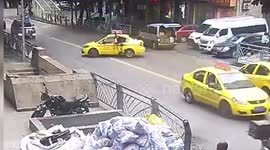 Taxi pulls out onto road in China seeing cyclist fly through its window