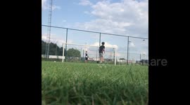 'One in a million shot!' Belgian teenager accidentally kicks football into a moving car