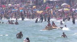 Britain hits beach to bask in bank holiday sun