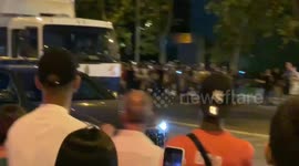 Real Madrid fans wait for players to leave the Bernabéu Stadium
