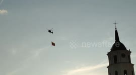 The helicopter carries the Lihuanian flag