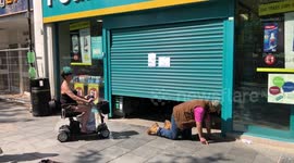 Poundland customers crawl into UK shop after shutter jams