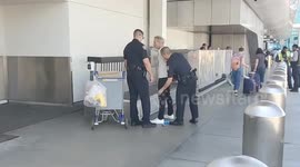 man told passenger he was going to harm people at the airport