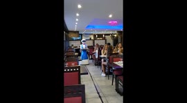 Robot waiter serves plates