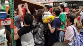 Customers climb under store shutter as China's first Costco shop opens