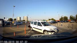 Wrong way driver in Romania karmically blows out bumper failing to reverse away