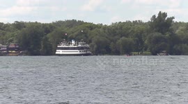 Toronto lake Ontario with boats and ferries on the water during the last days of summer and what pleasant weather it is in the city this late August as we head towards September