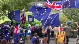 Journalists and protesters gather in Westminster after Parliament suspension announcement