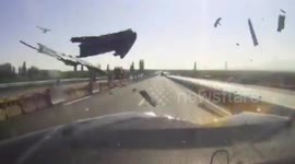 Tyre smashes into car on Chinese highway after falling off truck