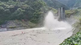 Firefighters in China use crane to rescue elderly man stranded in a river