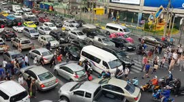 Cars cover zebra crossing during rush hour traffic in Bangkok