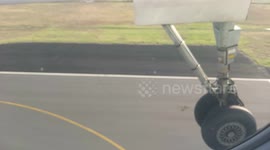 Slow motion landing gear touchdown close up