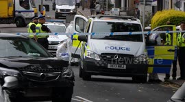 Police at the scene of a multiple stabbing in Watford, outside London