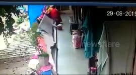 Elderly lady has remarkable escape when balcony wall collapses in India