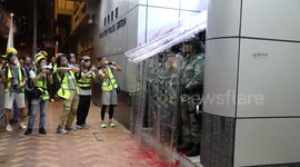 Hong Kong Anti Extradition Bill Protest 1st September 2019. Police outside Mong Kok police station take cover under riot shields after projectiles and red paint were thrown at them