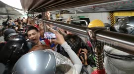 Fight in Hong Kong metro before riot police raid on Saturday